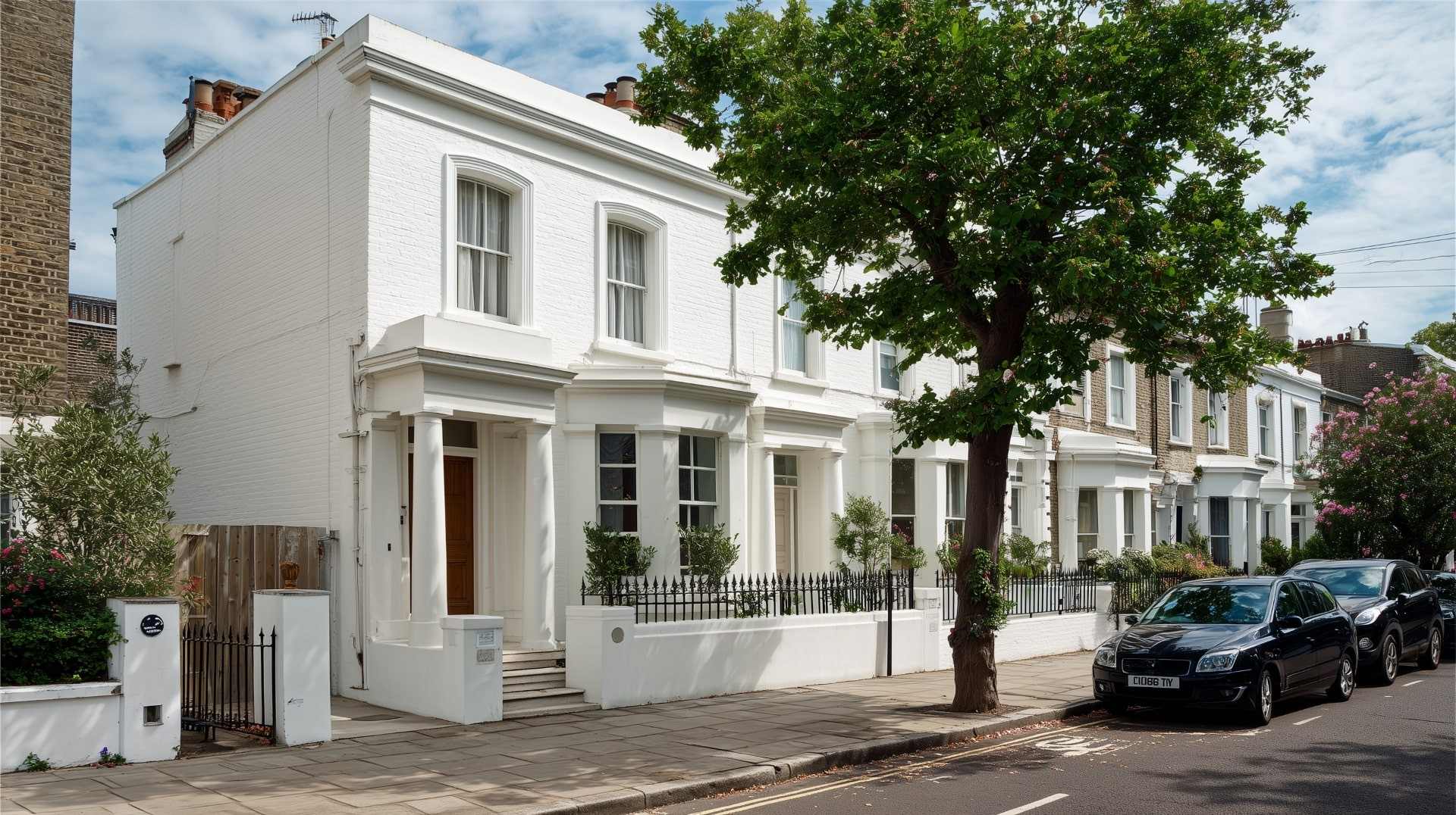 Elegant terraced houses featuring smooth white Weatherproof Coating for exterior protection