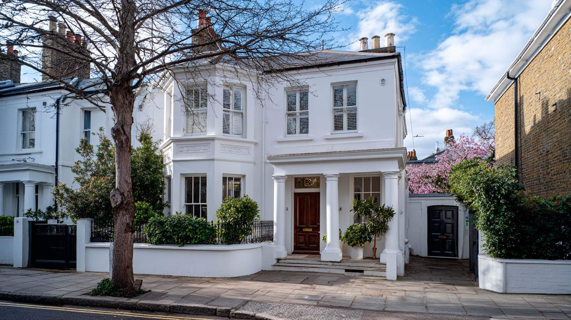 Restored white London home with clean exterior after full renovation and coating