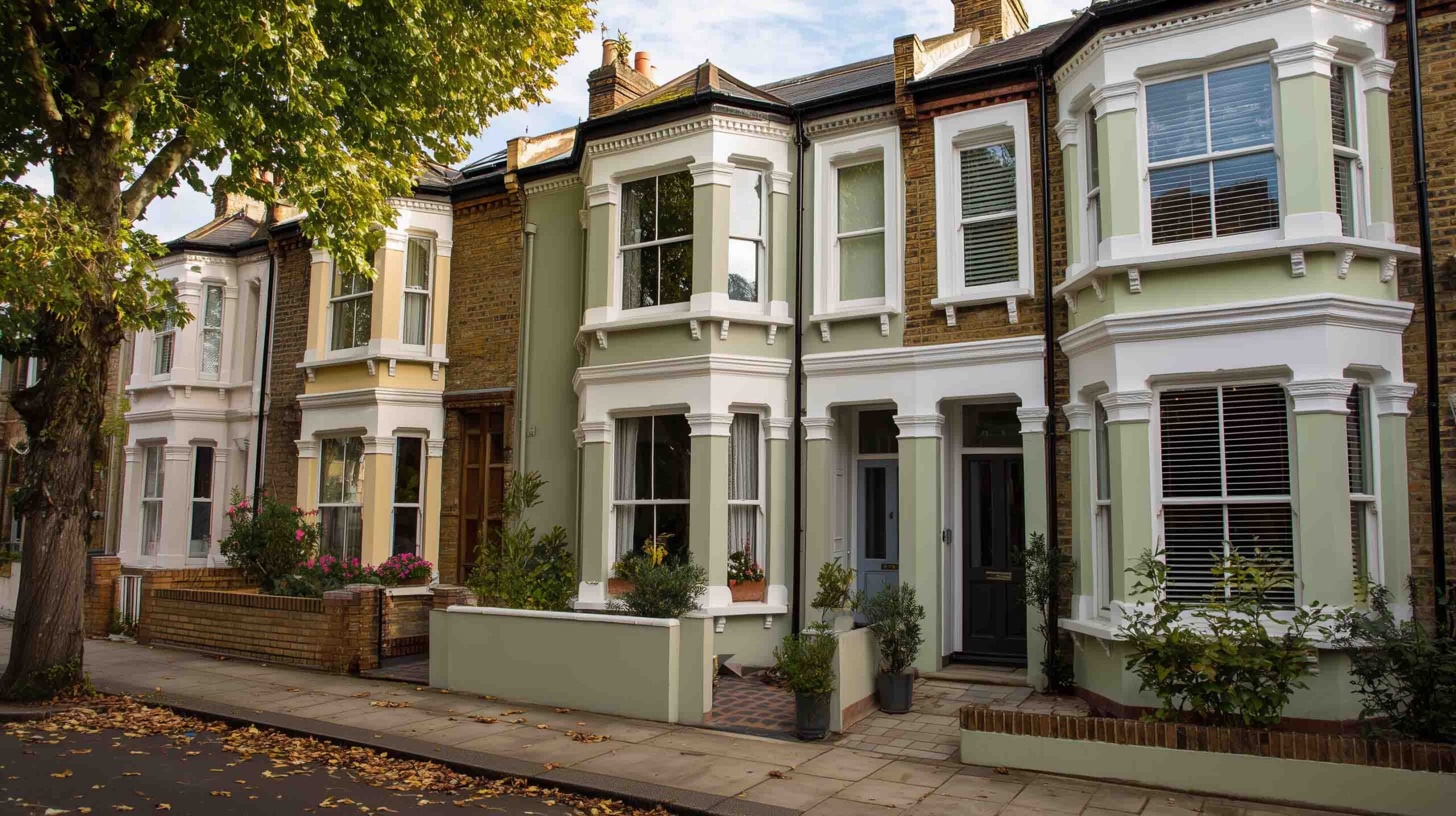 Victorian terraced houses coated with Silicone Rendering System for enhanced durability and elegant finish.