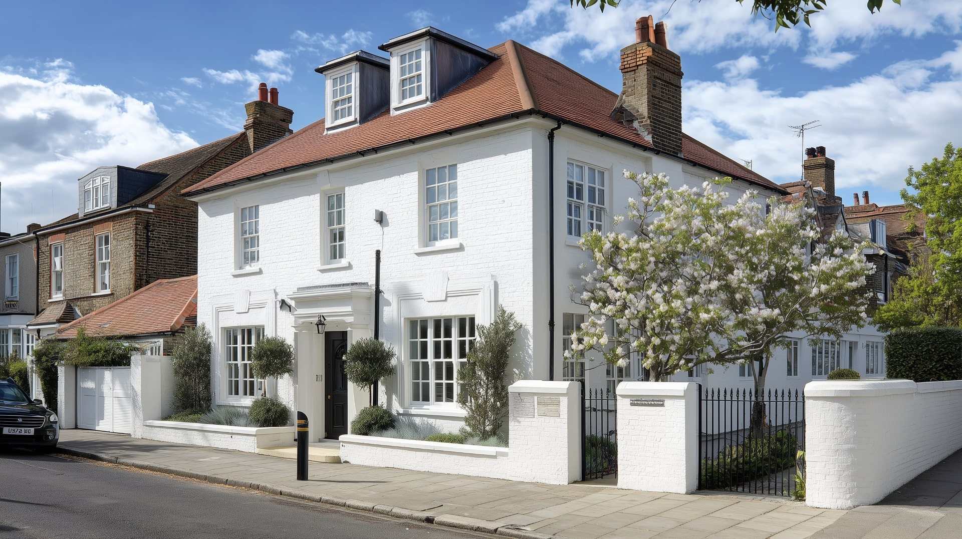 Modern London house featuring weatherproof wall coatings and elegant red roof design