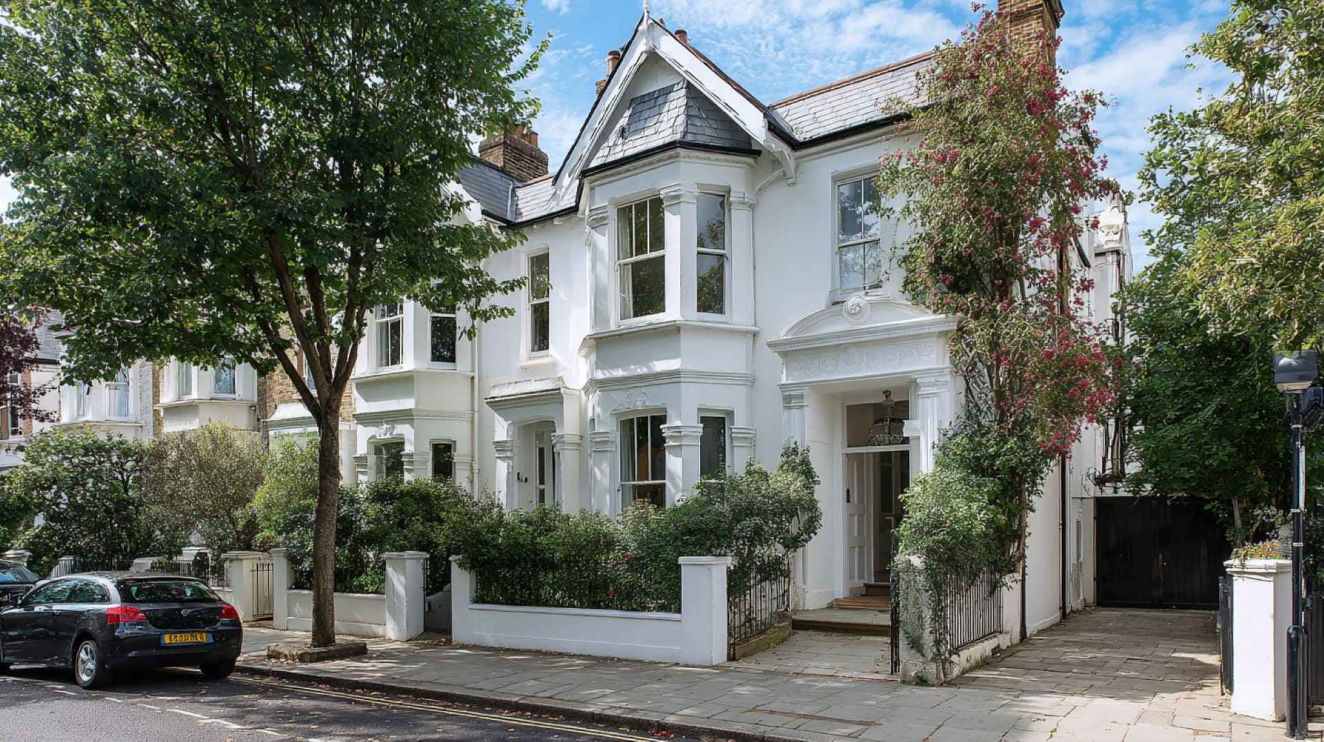 Victorian-style home with bright white Exterior Wall Paint enhancing its classic architectural features.